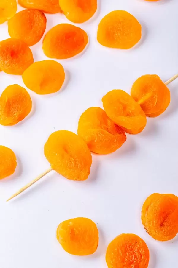 Dried apricots on white background