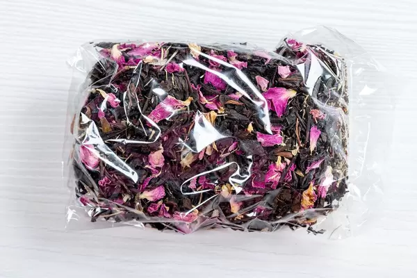 Dried Crimean black tea with pink flower petals in a package (Flip 2019)