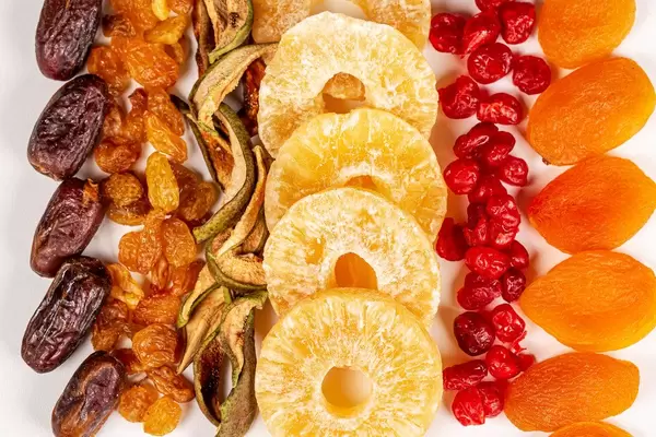Dried dates, raisins, pears, pineapples, cherries and apricots