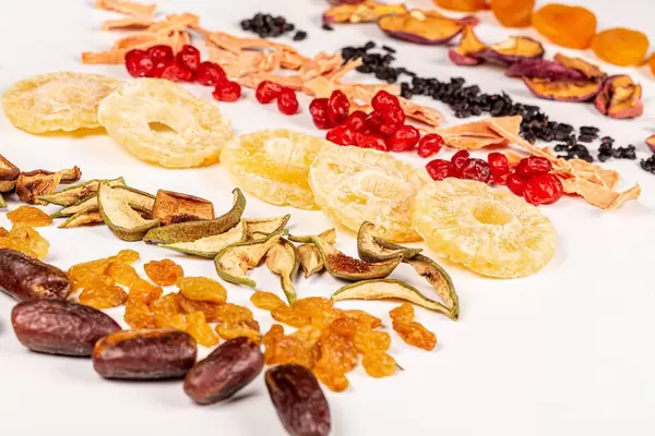 Dried fruits assortment on white background, healthy food concept
