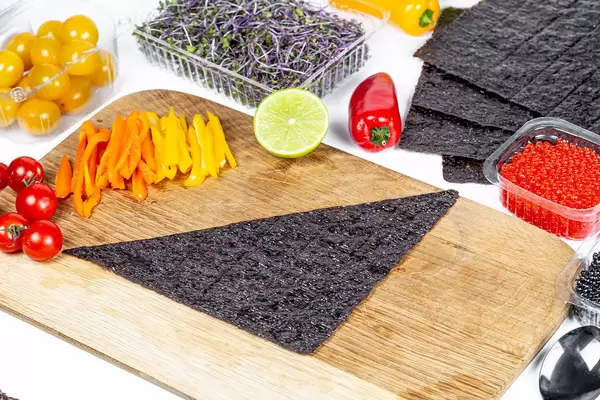 Dried nori with vegetables and caviar. Ingredients for making rolls