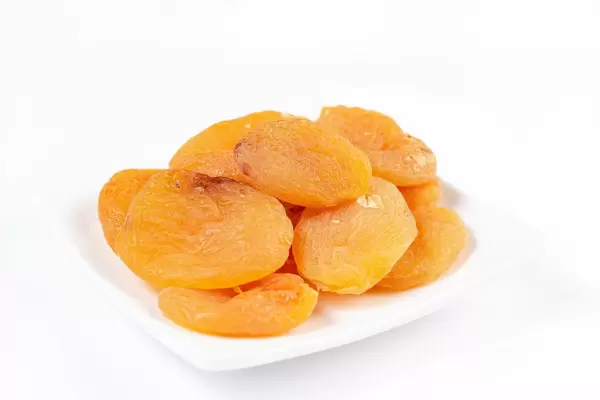 Dried Peaches on the white plate