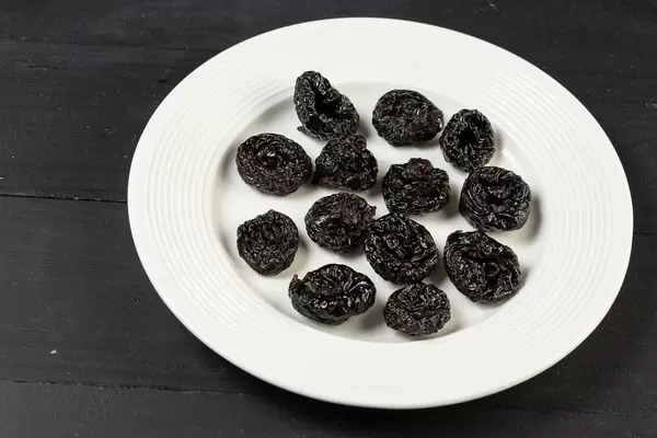 Dried Plums on the round plate