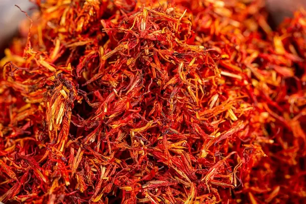 Dried red saffron spice background