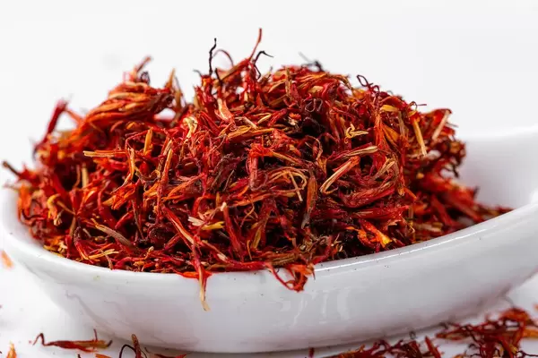Dried saffron spices on a light background. Close up