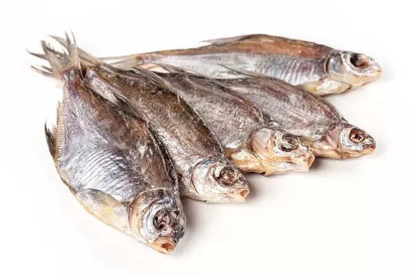 Dried salted roach on white background