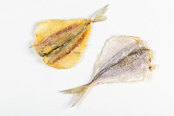 Dried silver horse mackerel on white
