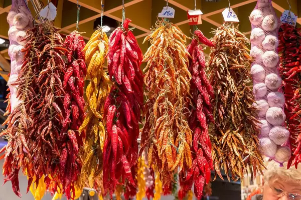 Dried spices such as chilli and garlic, displayed at the Mercat de la Boqueria market at the La Rambla promenade in Barcelona