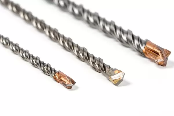 Drill bits of different sizes on white background