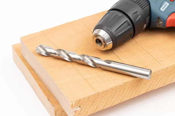 Drill on the Wooden Boards with white background