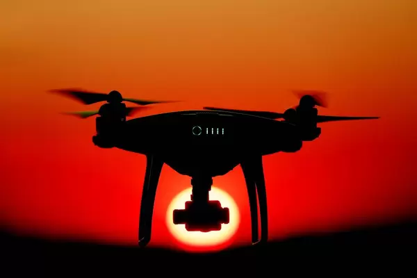 Drone facing sun at sunset, orange sky (Flip 2019)