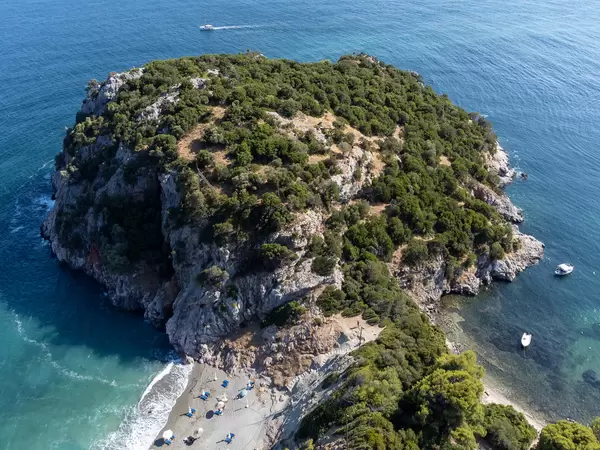 Drone photo of the headland and archaeological site separating Velanio and Stafylos beaches on Skopelos