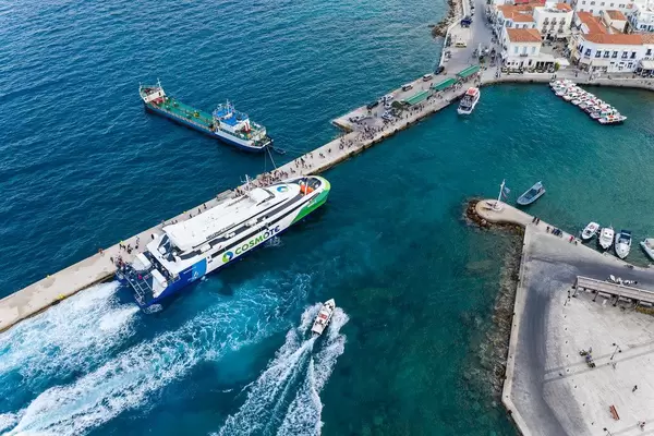 Drone picture of a ferry in the Argolic Gulf, which brings tourists to Prokymaia on Spetses, Greece