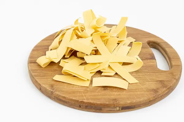 Dry homemade Pasta on the wooden board