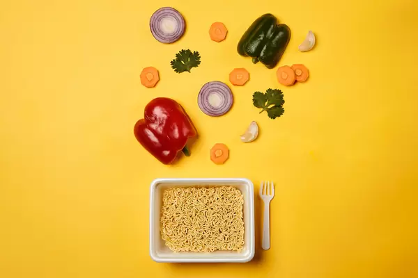 Dry instant noodle - asian ramen and vegetables for the soup