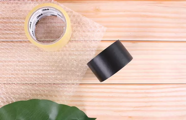 Duct tapes on wooden table