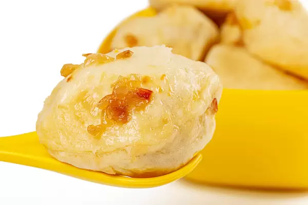 Dumpling in a spoon, close-up