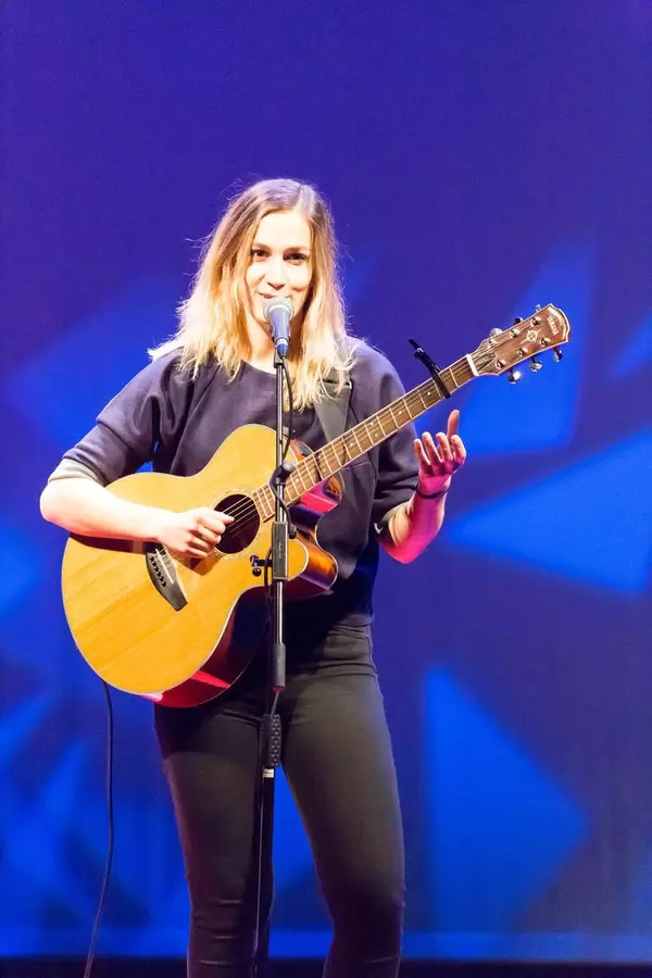 Dutch singer Marit Trienekens playing guitar - TEDxVenlo 2017