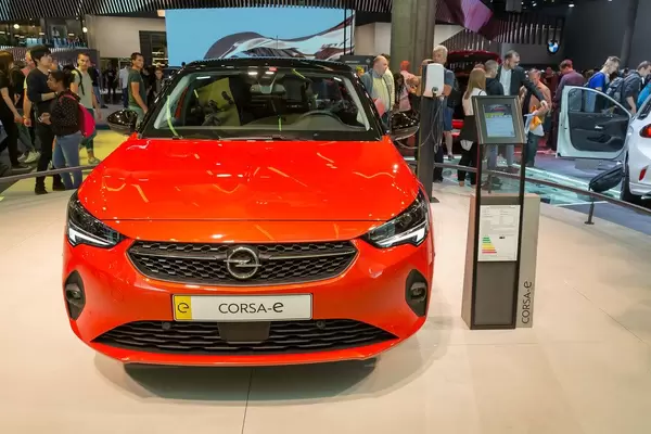 E-Mobilty by Opel: front view of red Corsa-e, electric car with keyless start and automatic climate control