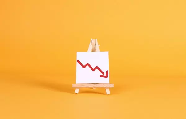 Easel with a red down arrow