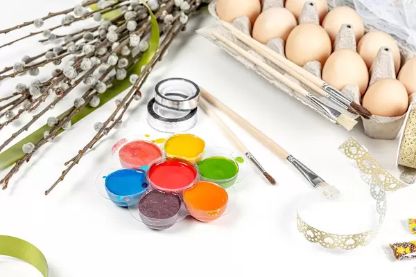 Easter-background-with-eggs-paints-brushes-and-willow-branches.jpg