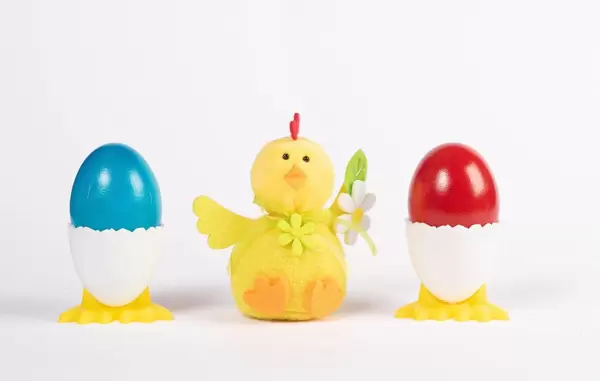 Easter chicken with two painted Easter eggs