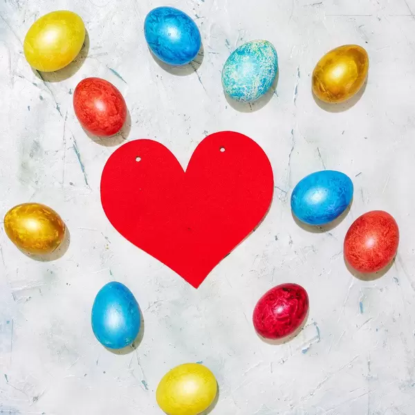 Easter concept. Easter eggs and a big paper red heart (Flip 2020)