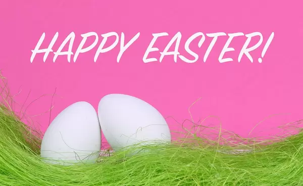 Easter eggs with Happy Easter text on pink background