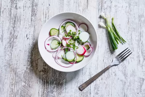 Eating fresh organic radish salad