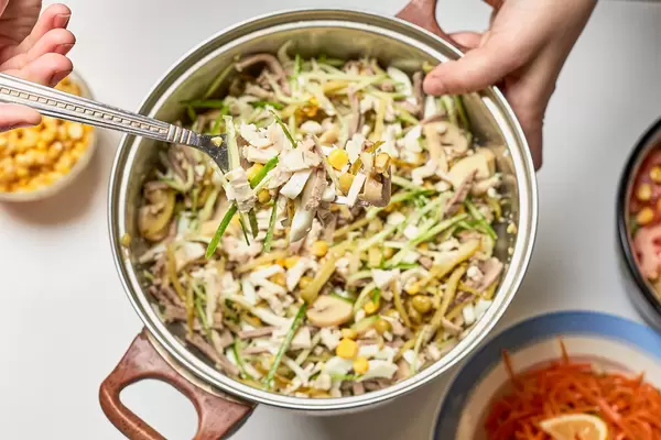 Eating homemade dieting salad full with vitamins