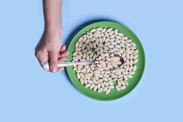 Eating medical pills with spoon