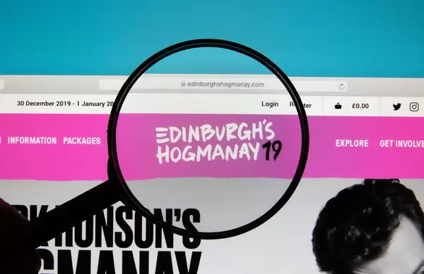 Edinburgh's Hogmanay logo on a computer screen with a magnifying glass