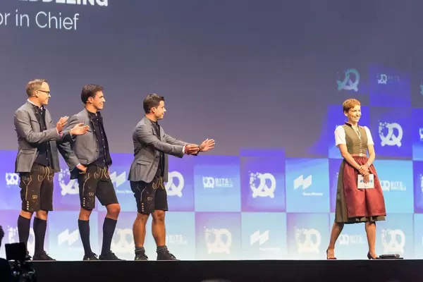 Editor in chief Britta Weddeling in Oktoberfest dress, next to Felix Haas, Andreas Bruckschloegl and Bernd Storm van's Gravesande