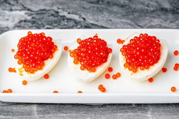 Egg and red caviar appetizer