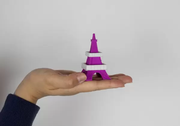 Eiffel Tower model in girls hand