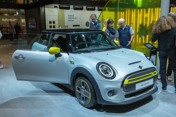 Electric car Mini Cooper SE in grey-yellow, with type 2 and CCS Combo 2 plug for charging