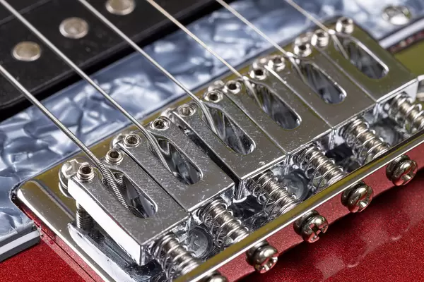 Electric Guitar's Bridge with Strings on it