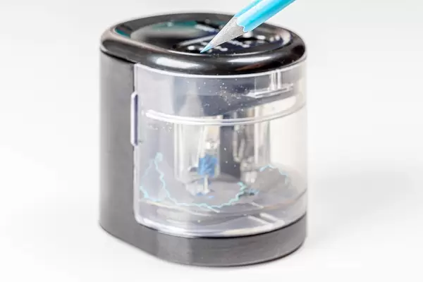 Electric pencil sharpener with auto-stop on a white background (Flip 2020)