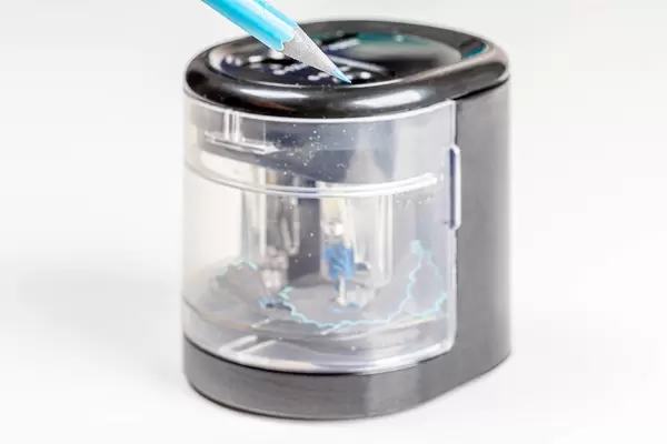 Electric pencil sharpener with auto-stop on a white background
