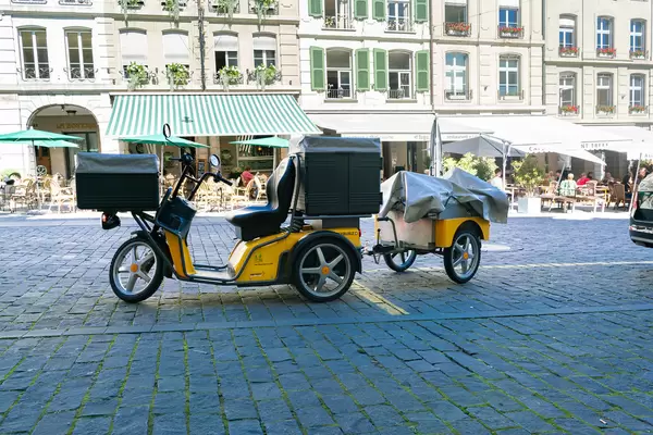Electric post delivery tricycle with a trailer in the city of Bern, Switzerland