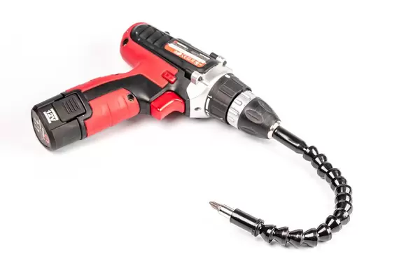 Electric screwdriver with a flexible extension on white background