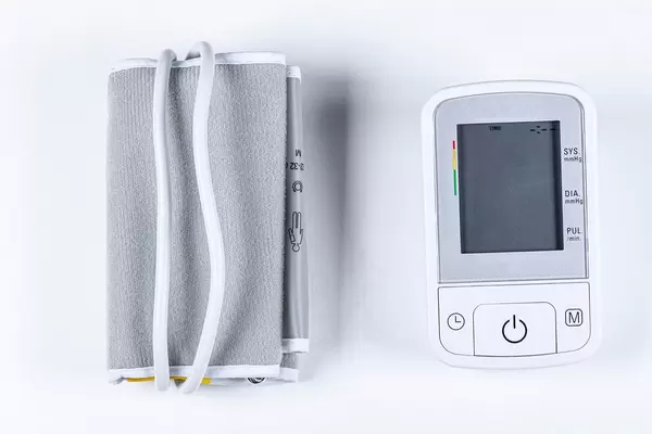 Electronic medical tonometer for measuring blood pressure on a white background