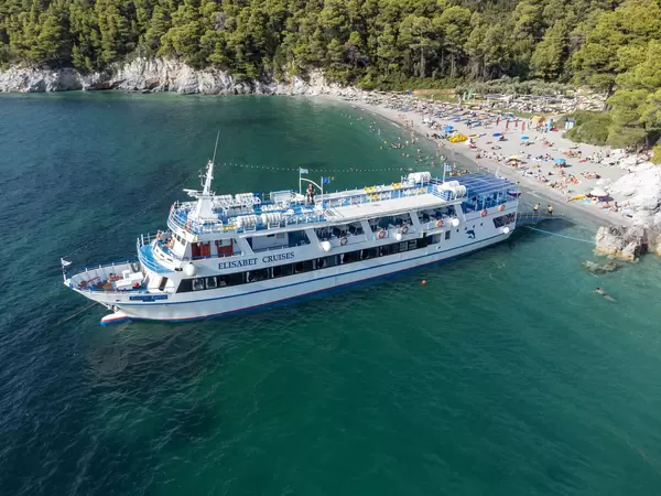 Elisabet cruise ship in front of Kastani beach: the most famous beach on Skopelos. Drone image