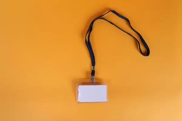 Empty name tag on orange background