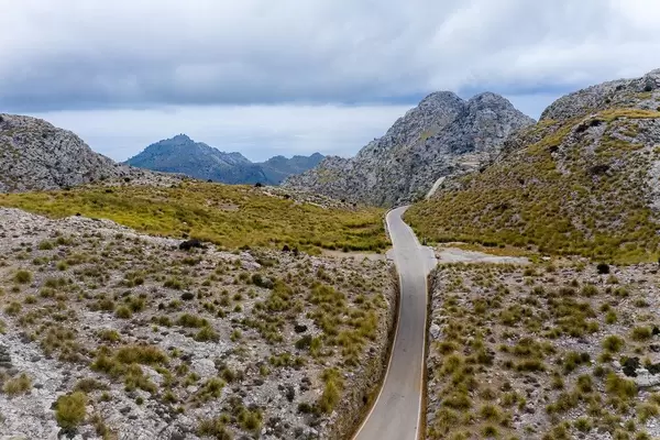 Empty road across rocky mountains: drone photo of Carretera de Sa Calobra. A must-see on Mallorca