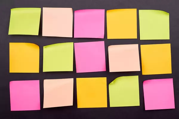 Empty sticky notes on the blackboard