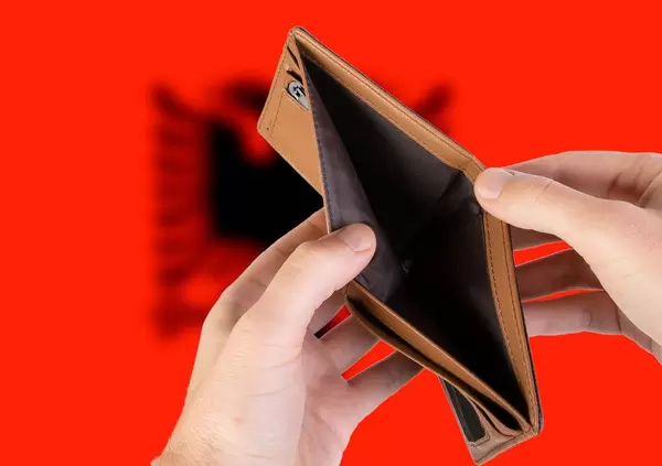 Empty Wallet with Flag of Albania. Recession and Financial Crisis to come with more debt and federal budget deficit?