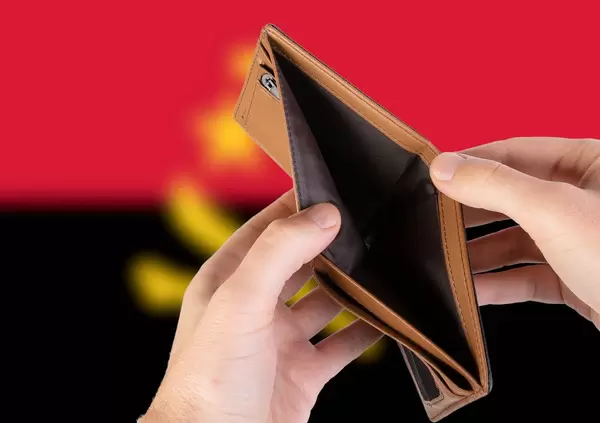 Empty Wallet with Flag of Angola. Recession and Financial Crisis to come with more debt and federal budget deficit?