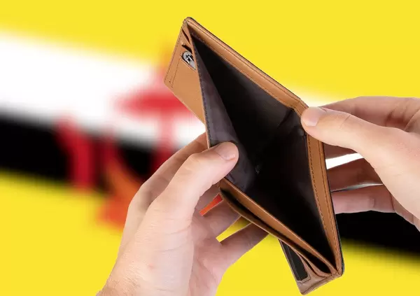 Empty Wallet with Flag of Brunei. Recession and Financial Crisis to come with more debt and federal budget deficit?