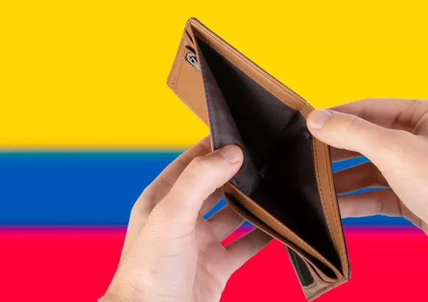 Empty Wallet with Flag of Colombia. Recession and Financial Crisis to come with more debt and federal budget deficit?